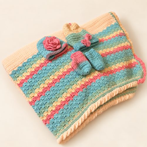 Pastel crochet blanket, hat, and booties from Jackie’s collection